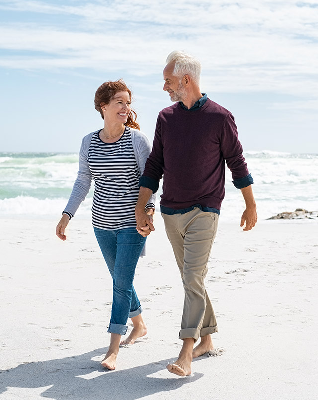 couple walking the beach together benefits of a fixed index annuity portsmouth nh